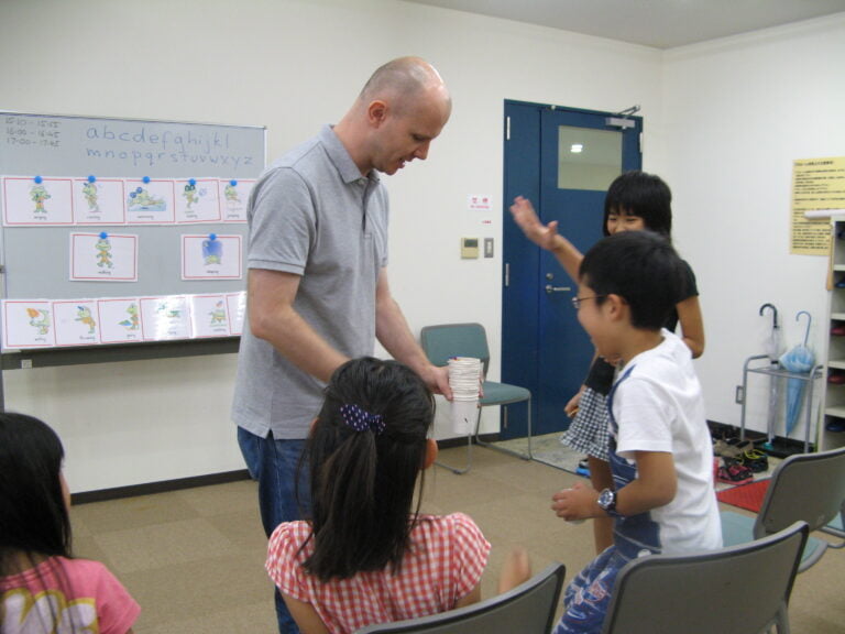 Students and teacher laughing together