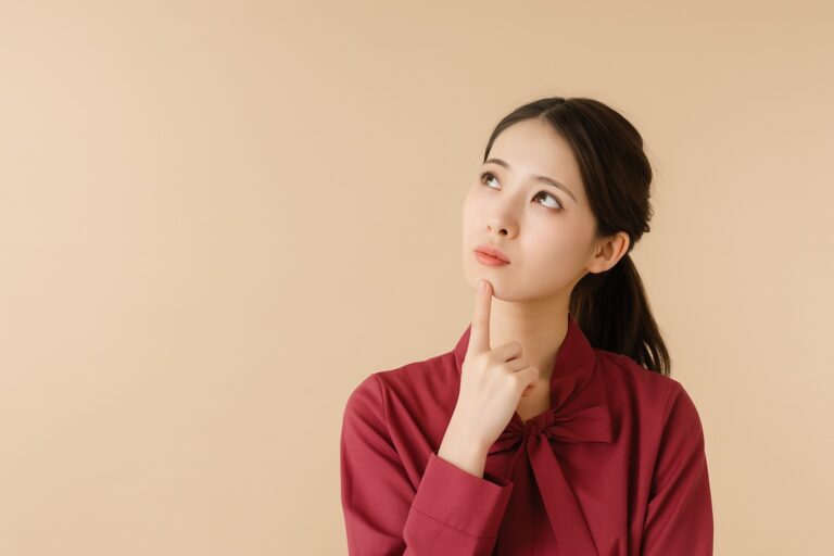 A woman thinking about English schools
