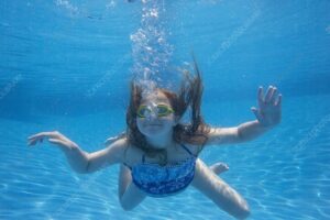 girl swimming underwater