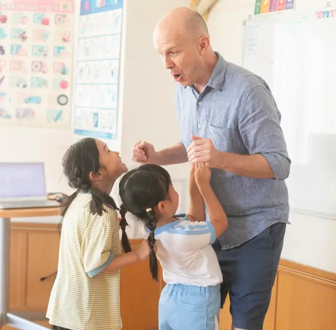 Teacher and kids having fun