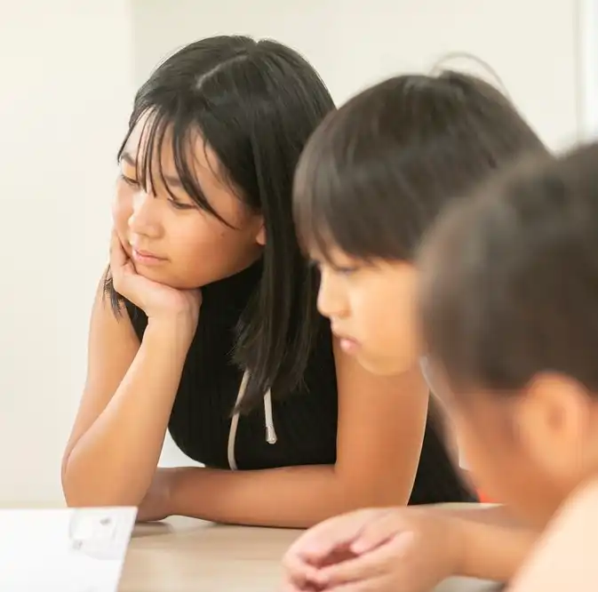 Girl listening to teacher