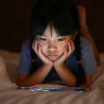 A girl looking at a tablet screen