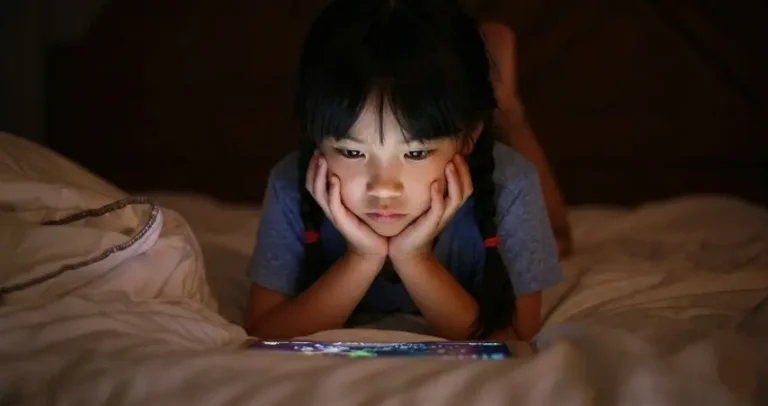 A girl looking at a tablet screen